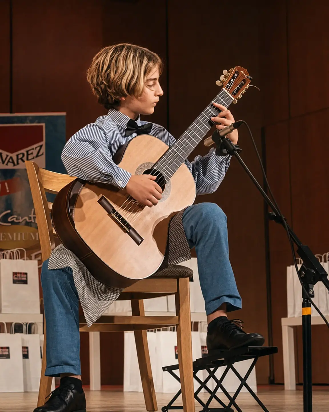 Young guitarist during a competition performance